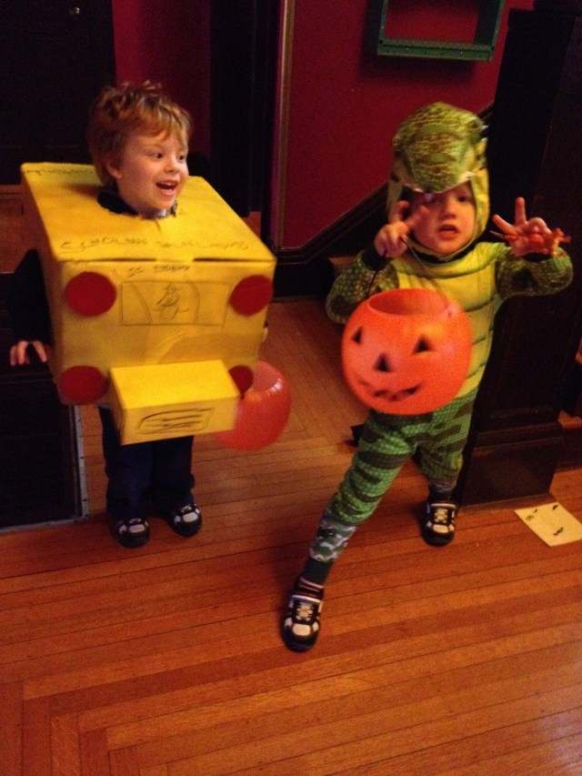 A school bus and his friend T-Rex.